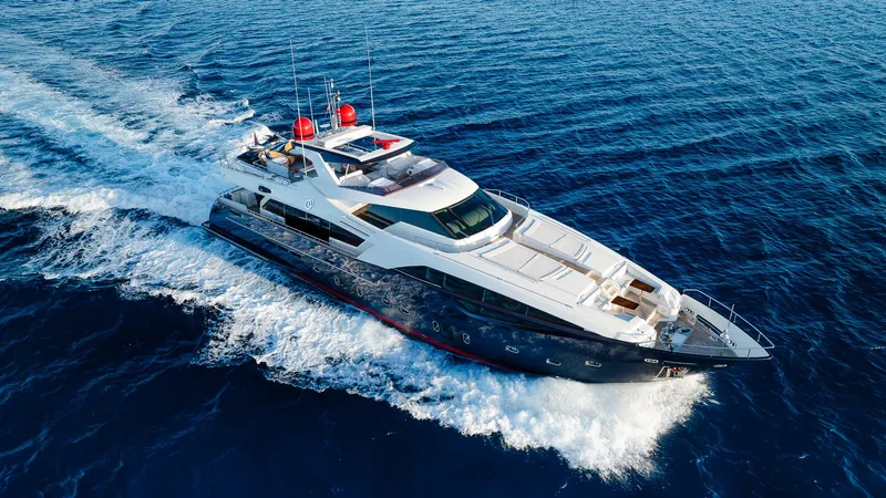 One And Only Yacht Photos Pics Luxurious 2012 Custom Line 100 yacht cruising on open blue sea.
