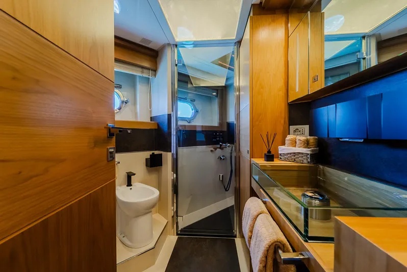 One And Only Yacht Photos Pics Luxurious yacht bathroom with modern fixtures, glass shower, and wooden cabinetry, Custom Line 100, 2012.