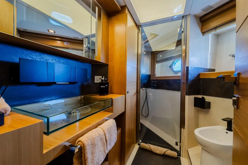 One And Only Yacht Photos Pics Luxurious yacht bathroom with glass sink, wooden accents, and modern shower, Custom Line 100, 2012.