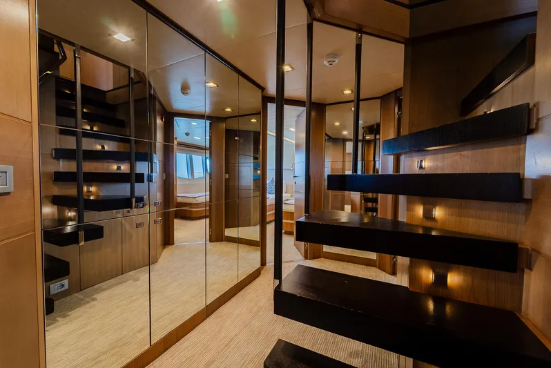 One And Only Yacht Photos Pics Luxurious yacht interior with modern staircase, mirrored walls, and elegant wood finishes, Custom Line 100, 2012.