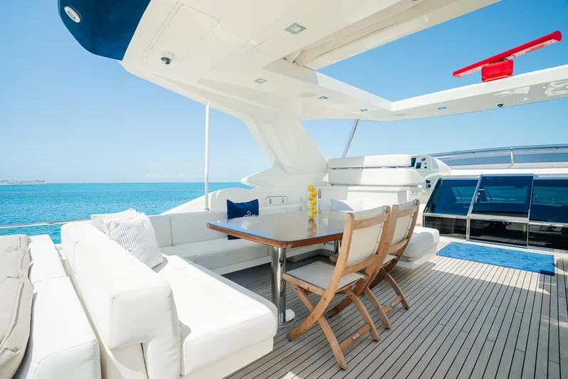 One And Only Yacht Photos Pics Luxurious 2012 Custom Line 100 yacht deck with elegant seating and ocean view.