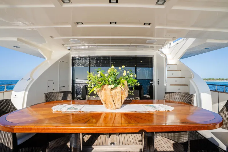 One And Only Yacht Photos Pics Luxurious yacht deck with elegant wooden table, floral centerpiece, and ocean view. Custom Line 100, 2012.