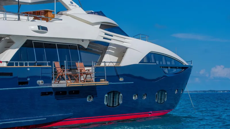 One And Only Yacht Photos Pics Luxurious 2012 Custom Line 100 yacht on blue ocean waters under clear skies.