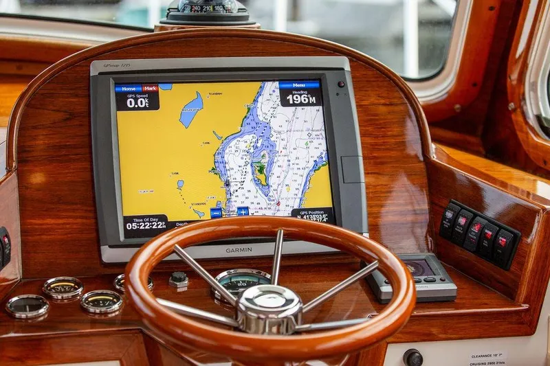Chaser Yacht Photos Pics Hinckley Picnic Boat EP 2004 helm with GPS navigation system and wooden steering wheel.