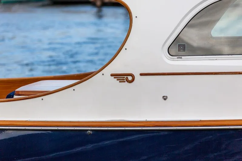 Chaser Yacht Photos Pics 2004 Hinckley Picnic Boat EP, elegant design detail with wood accents by the water.