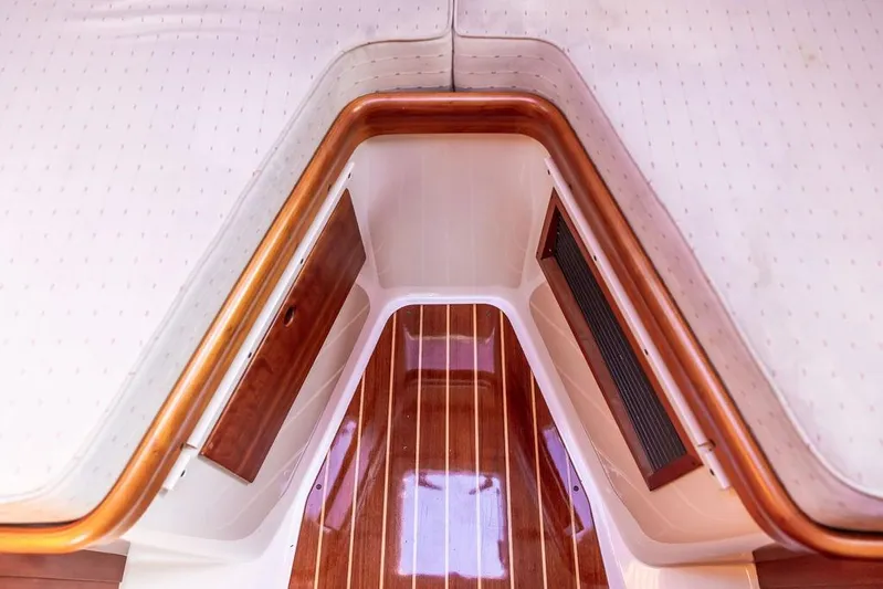 Chaser Yacht Photos Pics Interior of 2004 Hinckley Picnic Boat EP with wood accents and striped flooring.