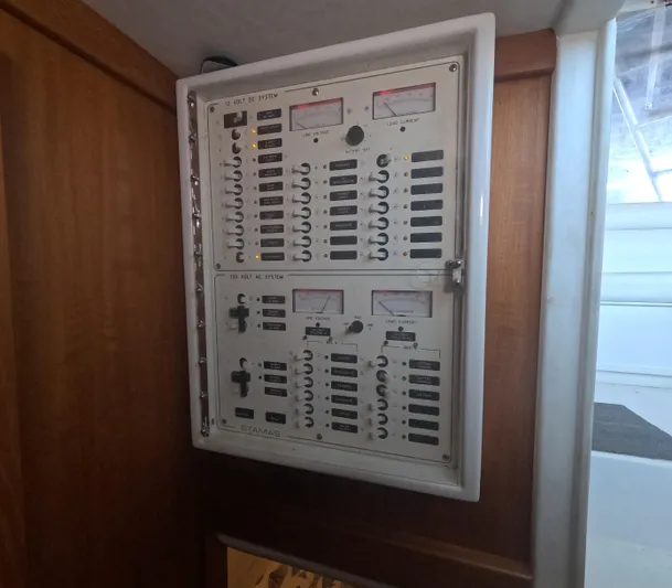  Yacht Photos Pics Electrical panel inside 2005 Stamas 370 Express boat, featuring switches and meters.