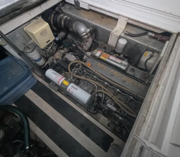  Yacht Photos Pics Engine compartment of a 2005 Stamas 370 Express boat, showcasing mechanical components.