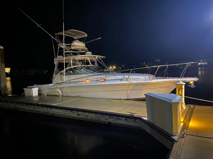  Yacht Photos Pics 2005 Stamas 370 Express yacht docked at night, illuminated by dock lights.