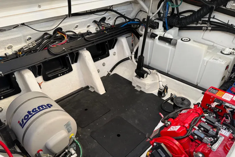  Yacht Photos Pics Engine compartment of 2022 Monterey 385SS Super Sport boat with visible components and wiring.