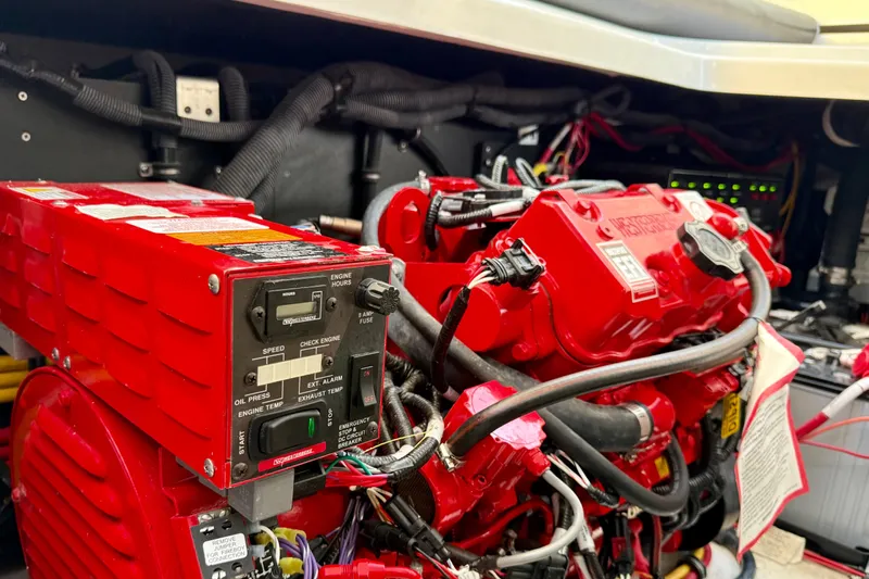 Yacht Photos Pics Engine compartment of a 2022 Monterey 385SS Super Sport, featuring vibrant red components.
