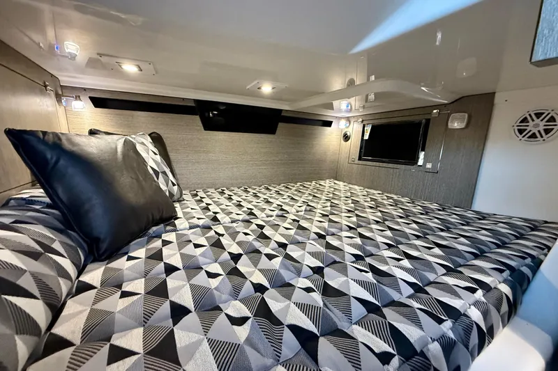  Yacht Photos Pics Luxurious cabin interior of 2022 Monterey 385SS Super Sport with geometric bedding design.