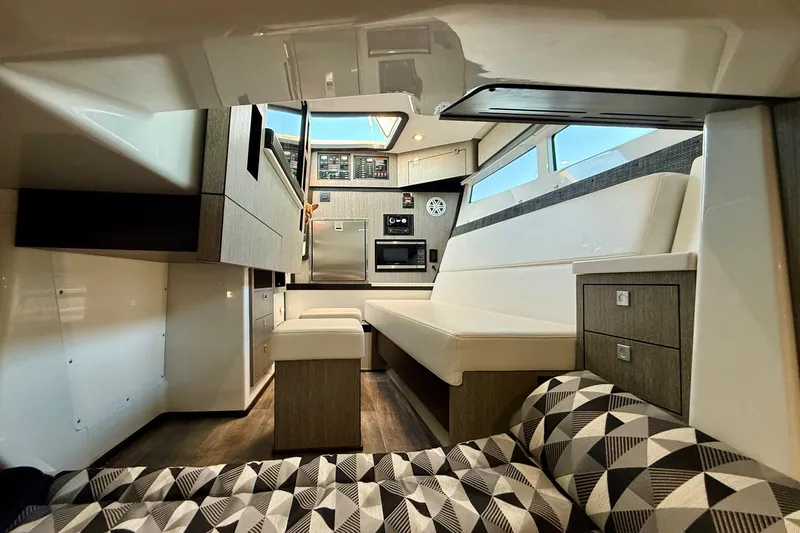  Yacht Photos Pics Interior of 2022 Monterey 385SS Super Sport boat, featuring modern seating and cabinetry.