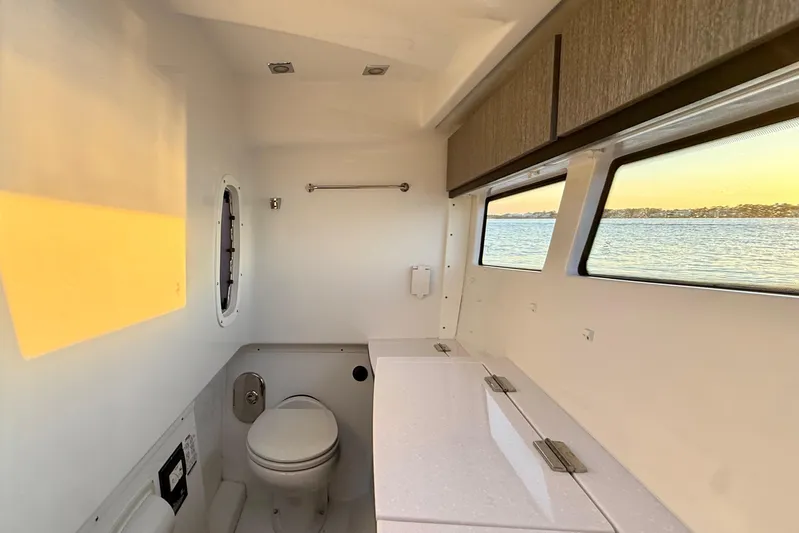  Yacht Photos Pics Interior of 2022 Monterey 385SS Super Sport boat with bathroom and scenic window view.