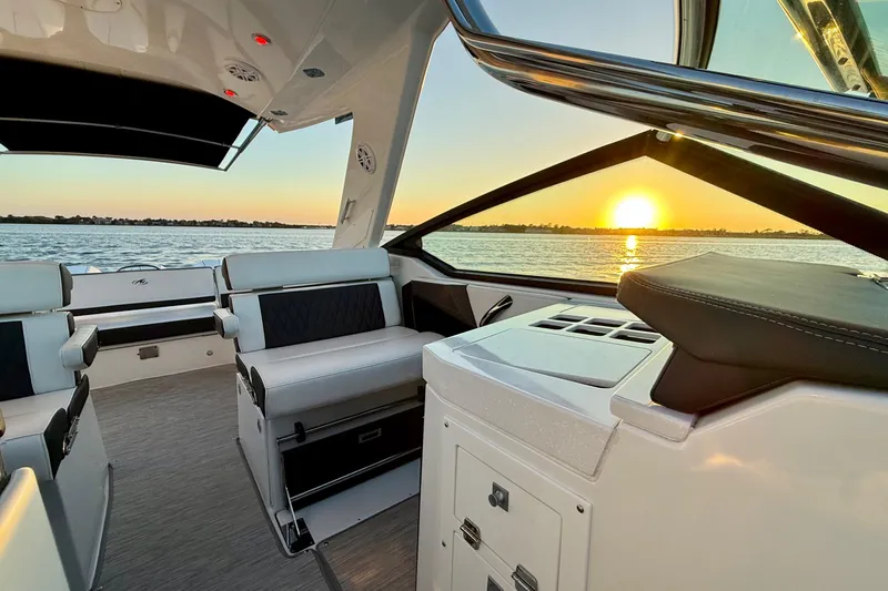  Yacht Photos Pics 2022 Monterey 385SS Super Sport boat interior at sunset on the water.