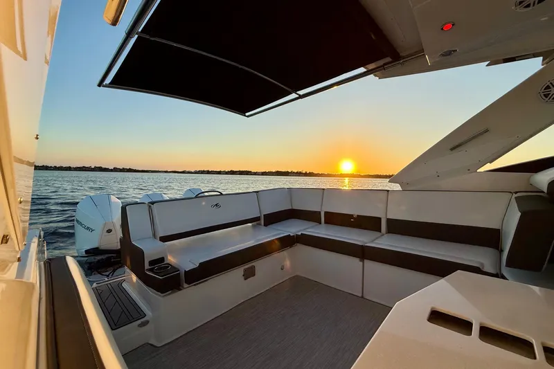  Yacht Photos Pics 2022 Monterey 385SS Super Sport boat interior at sunset on the water.