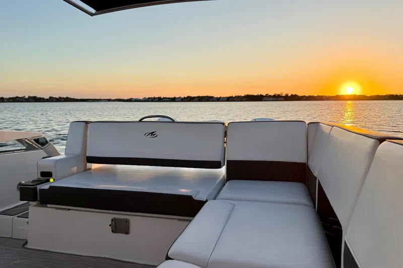 Yacht Photos Pics 2022 Monterey 385SS Super Sport boat interior at sunset on a serene lake.