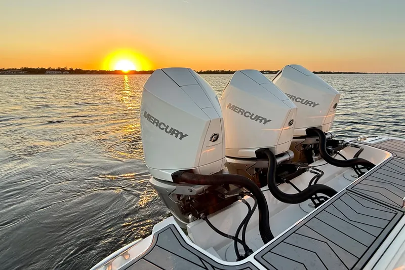  Yacht Photos Pics 2022 Monterey 385SS Super Sport boat with Mercury engines at sunset on the water.