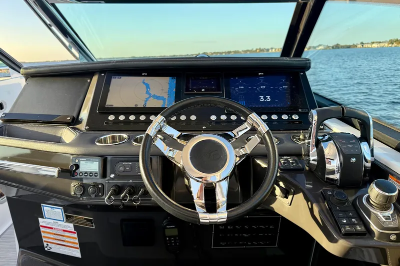  Yacht Photos Pics Cockpit of 2022 Monterey 385SS Super Sport boat with advanced navigation controls.