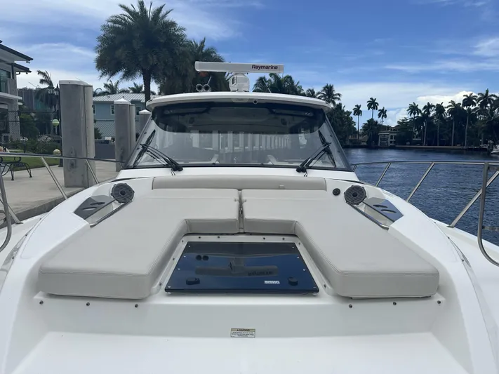 Isle Hope'n Yacht Photos Pics 2022 Boston Whaler 405 Conquest docked, showcasing sleek design and spacious deck.