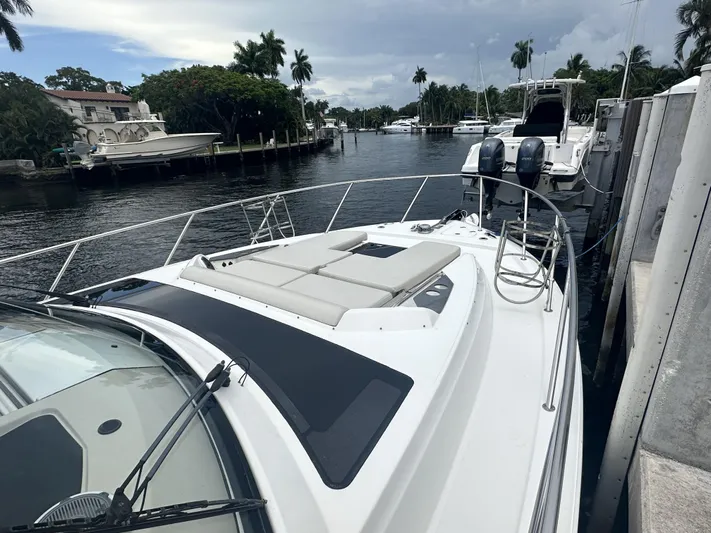 Isle Hope'n Yacht Photos Pics 2022 Boston Whaler 405 Conquest docked in a scenic marina setting.