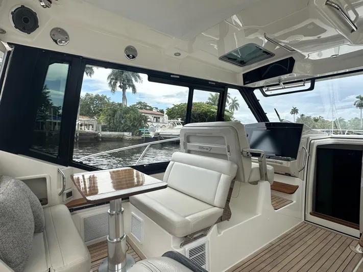 Isle Hope'n Yacht Photos Pics Interior of 2022 Boston Whaler 405 Conquest boat with luxurious seating and waterfront view.