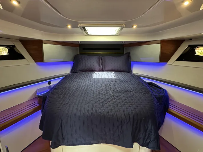 Isle Hope'n Yacht Photos Pics Luxurious cabin interior of 2022 Boston Whaler 405 Conquest with ambient lighting and comfortable bedding.