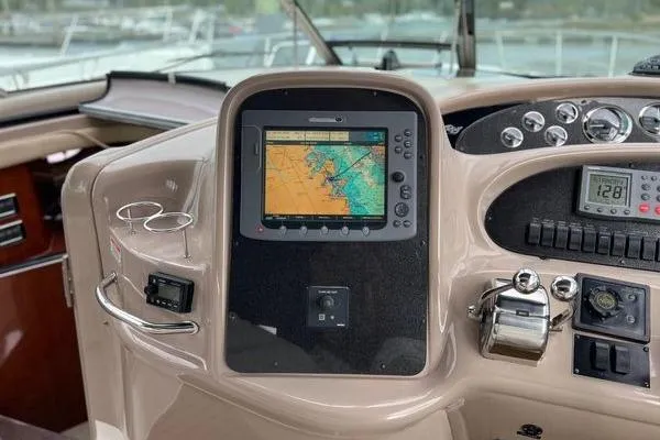  Yacht Photos Pics 2003 Sea Ray 410 Sundancer helm with navigation display and control panel.