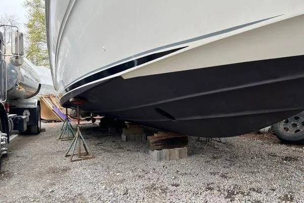  Yacht Photos Pics 2003 Sea Ray 410 Sundancer boat on stands, side view, outdoors.