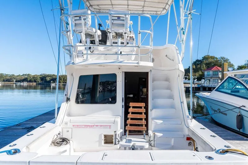  Yacht Photos Pics 2004 Luhrs 36 Convertible yacht docked, featuring spacious deck and flybridge.