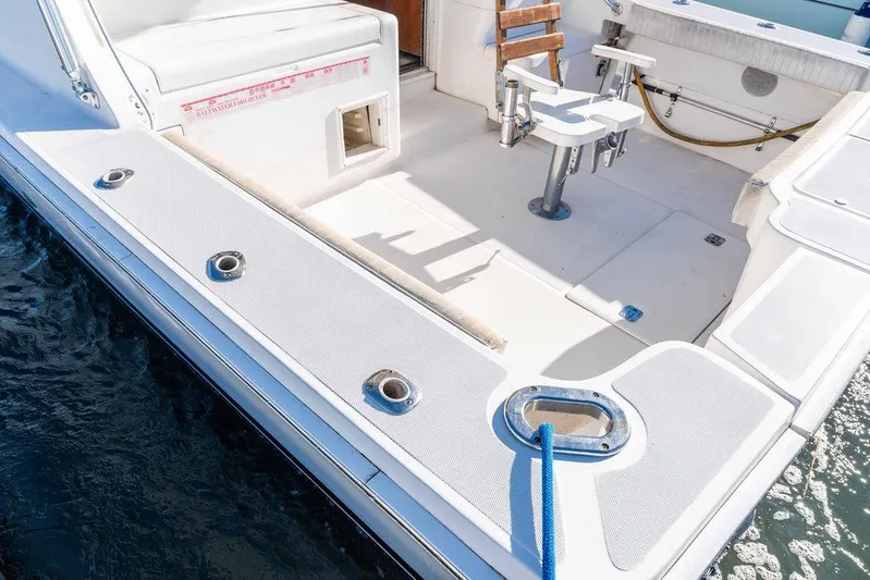  Yacht Photos Pics 2004 Luhrs 36 Convertible boat deck with fishing chair and rod holders.