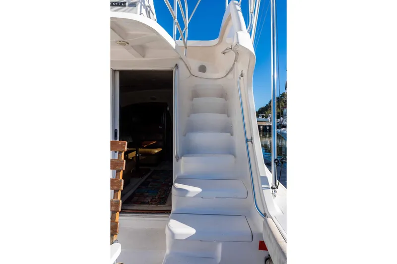  Yacht Photos Pics 2004 Luhrs 36 Convertible yacht with white stairs and open cabin view.