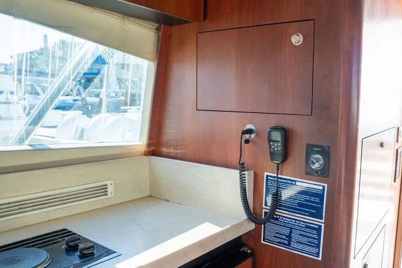  Yacht Photos Pics Interior of 2004 Luhrs 36 Convertible yacht with communication equipment and countertop.