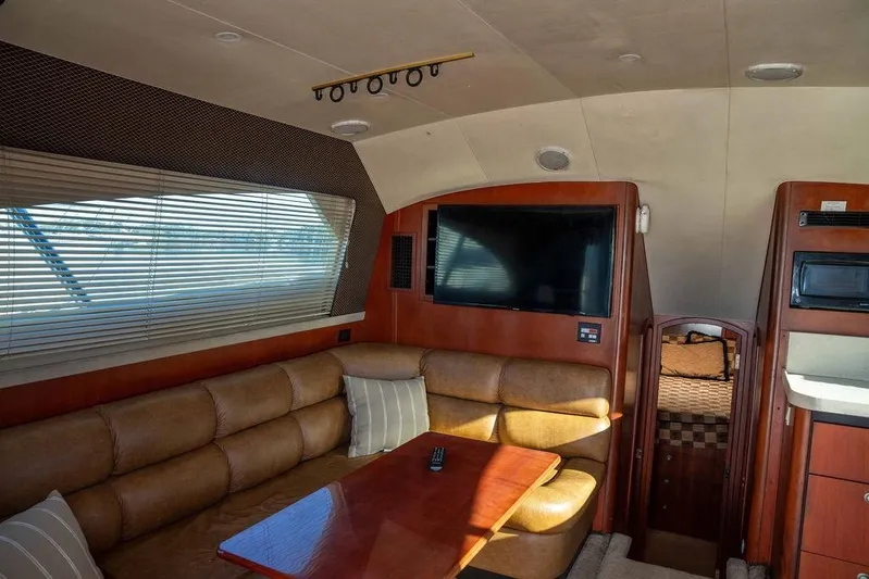  Yacht Photos Pics Luxurious interior of 2004 Luhrs 36 Convertible yacht with leather seating and modern amenities.