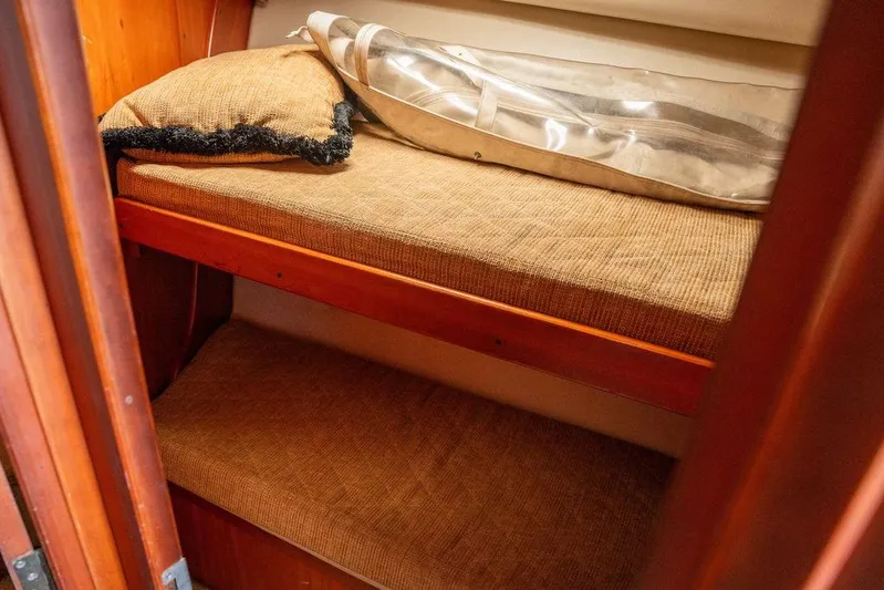  Yacht Photos Pics 2004 Luhrs 36 Convertible cabin with cozy bunk beds and wooden interior.