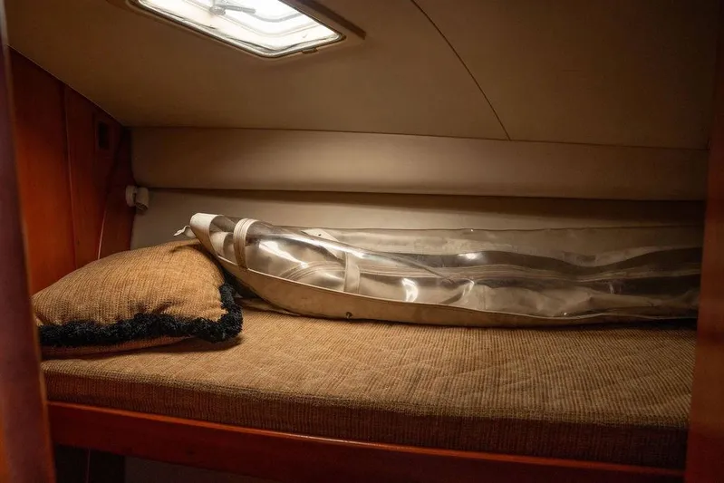  Yacht Photos Pics 2004 Luhrs 36 Convertible cabin with cozy bed and pillow.