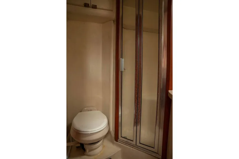  Yacht Photos Pics 2004 Luhrs 36 Convertible yacht bathroom with shower and toilet.