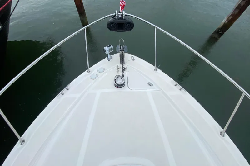  Yacht Photos Pics Top view of 2004 Sea Ray 340 Sundancer boat bow with anchor and railing.