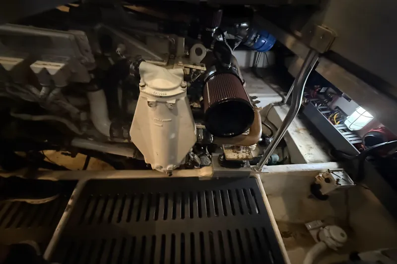  Yacht Photos Pics Engine room of a 2005 Luhrs 38 Convertible boat, showcasing mechanical components.