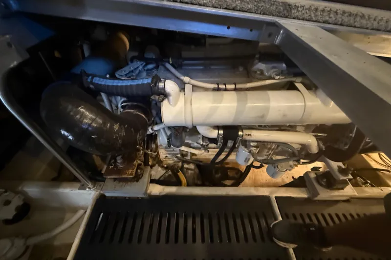  Yacht Photos Pics Engine compartment of a 2005 Luhrs 38 Convertible boat, showcasing mechanical components.
