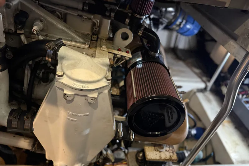  Yacht Photos Pics Engine compartment of a 2005 Luhrs 38 Convertible boat, showcasing mechanical components.