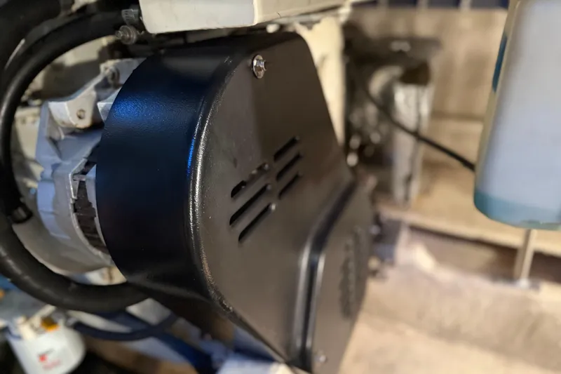  Yacht Photos Pics Engine component of a 2005 Luhrs 38 Convertible boat, featuring a black protective cover.