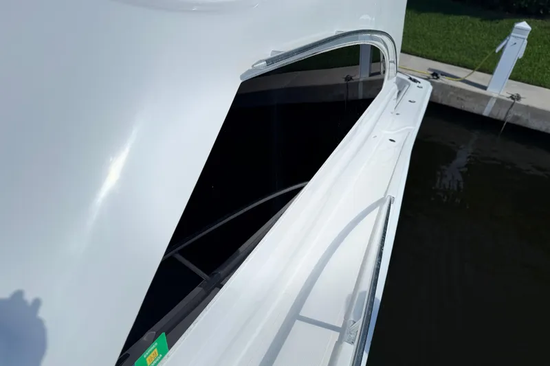  Yacht Photos Pics 2005 Luhrs 38 Convertible yacht, side view with sleek design and railing.