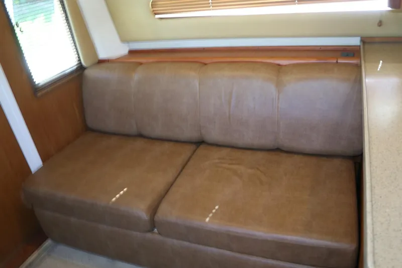  Yacht Photos Pics Brown leather sofa in 2005 Luhrs 38 Convertible boat interior.