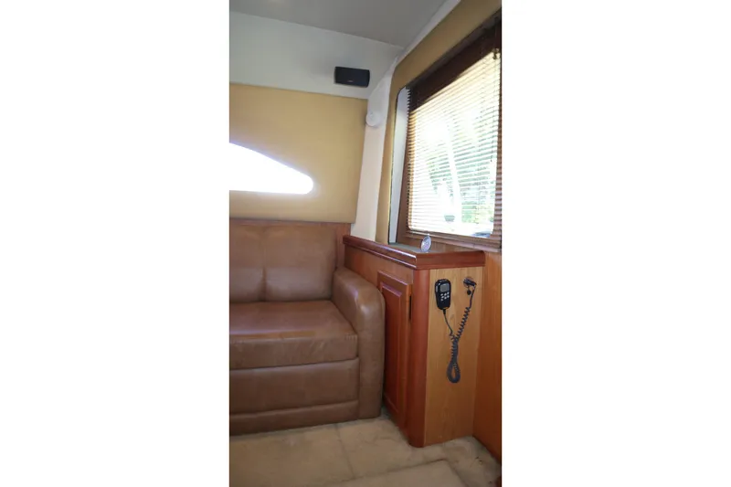  Yacht Photos Pics Interior of 2005 Luhrs 38 Convertible yacht with leather seating and wood paneling.