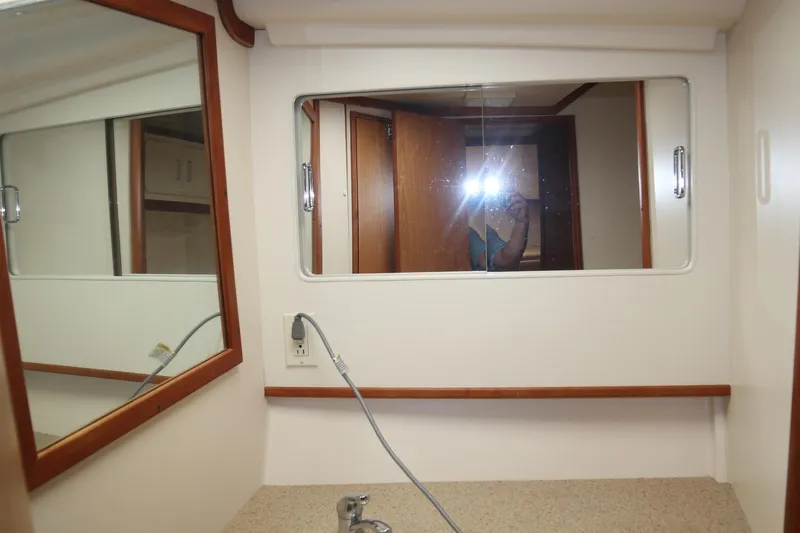  Yacht Photos Pics 2005 Luhrs 38 Convertible yacht bathroom with mirror and countertop.