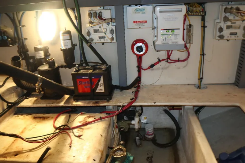  Yacht Photos Pics Engine room of 2005 Luhrs 38 Convertible with battery and electrical components.