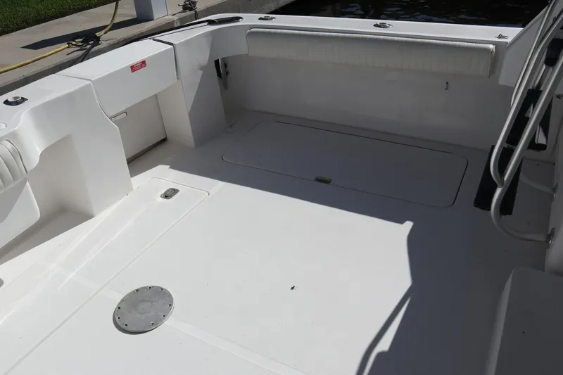  Yacht Photos Pics 2005 Luhrs 38 Convertible boat deck with clean, spacious layout and storage compartments.