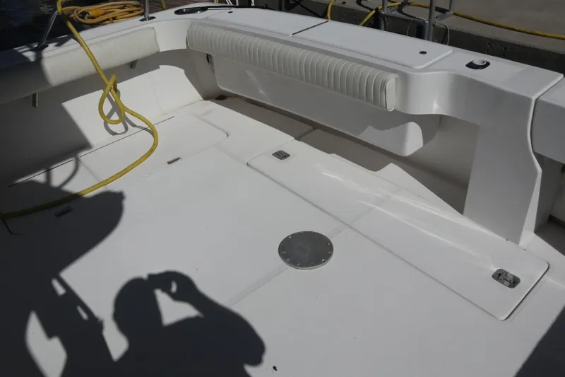  Yacht Photos Pics 2005 Luhrs 38 Convertible boat deck with seating and coiled yellow rope.