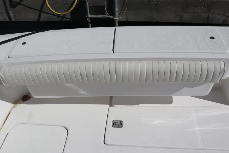  Yacht Photos Pics 2005 Luhrs 38 Convertible boat deck with cushioned seating and storage compartments.